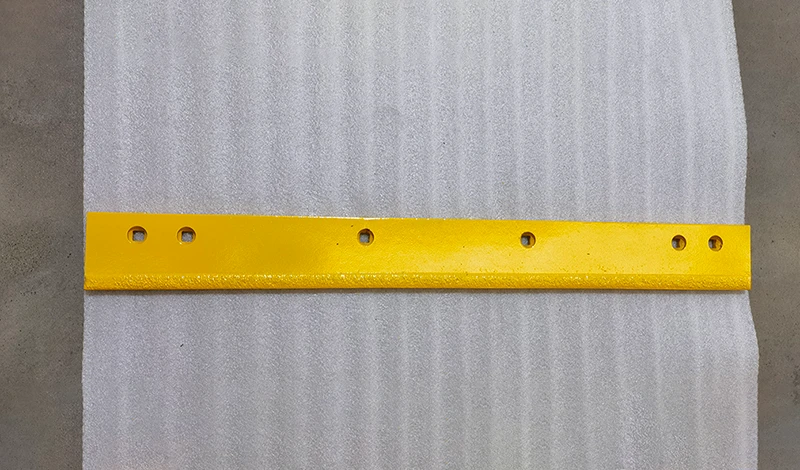Carbide highway plow blade mounted on a truck and prepared for a one-route specification trial